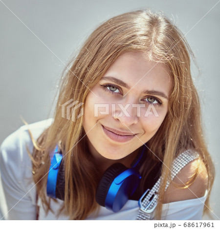Attractive young white woman walks outdoor. Attractive young white woman walks outdoor. 68617961