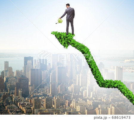 Businessman in investment concept watering financial line chart 68619473