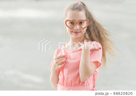 Adorable valentines girl. Cute kid holding fancy 68620820