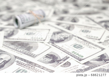 US dollars rolled up and tightened with band lies US dollars rolled up and tightened with band lies 68621277