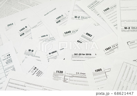 Many tax form blanks lies on table close up. Tax Many tax form blanks lies on table close up. Tax 68621447