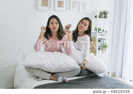 Lesbian couple homosexual happiness lifestyle on bed. Two pretty girlfriend talk 68626436