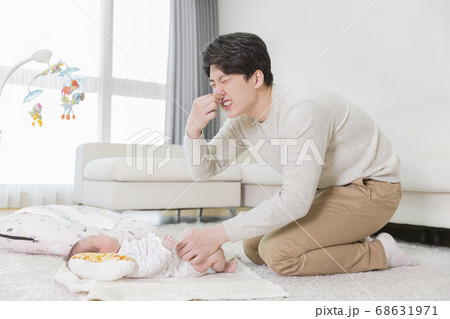 Modern young family concept, young mother and father with newborn 525 68631971
