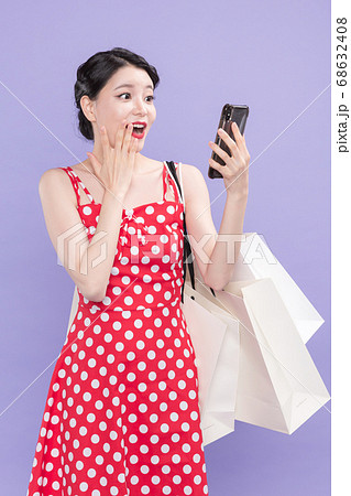 Life style concept, happy shopping time. Young asian woman with shopping bags and cart. 506 68632408
