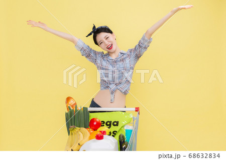 Life style concept, happy shopping time. Young asian woman with shopping bags and cart. 446 Life style concept, happy shopping time. Young asian woman with shopping bags and cart. 446 68632834