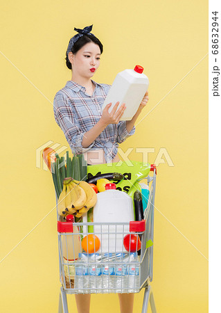 Life style concept, happy shopping time. Young asian woman with shopping bags and cart. 453 68632944