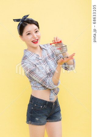 Life style concept, happy shopping time. Young asian woman with shopping bags and cart. 424 68633105