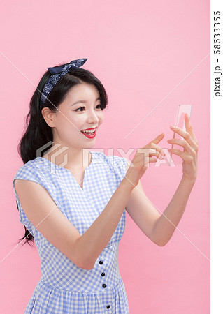 Life style concept, happy shopping time. Young asian woman with shopping bags and cart. 173 Life style concept, happy shopping time. Young asian woman with shopping bags and cart. 173 68633356