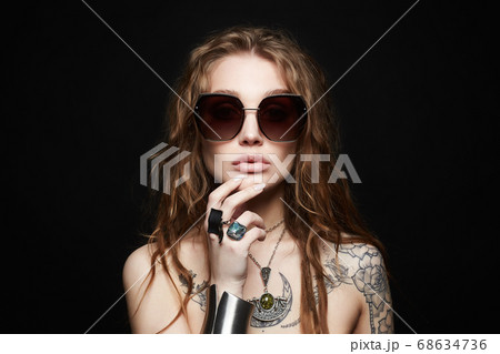 beauty tattooed girl in sunglasses and jewelry beauty tattooed girl in sunglasses and jewelry 68634736