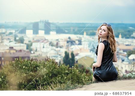 The beautiful lonely girl in black dress and 68637954