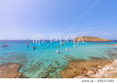 The cleanest turquoise sea off the coast Cala Escondida. Ibiza, Balearic Islands. Spain The cleanest turquoise sea off the coast Cala Escondida. Ibiza, Balearic Islands. Spain 68641989