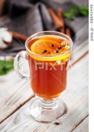 Moroccan tea with lemon and spices in a glass mug 68643449