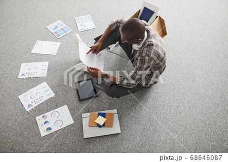 Businessman examining the charts Businessman examining the charts 68646087