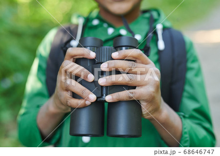 Boy with binoculars Boy with binoculars 68646747