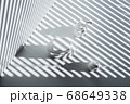 Still life with three white vials and diagonal striped shadow 68649338