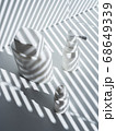 Composition with three white plastic and glass vials in rays of the sun 68649339