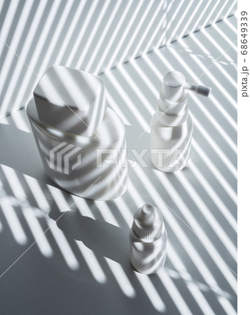 Composition with three white plastic and glass vials in rays of the sun Composition with three white plastic and glass vials in rays of the sun 68649339
