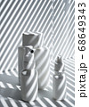 Three white plastic and glass vials in rays of the sun 68649343