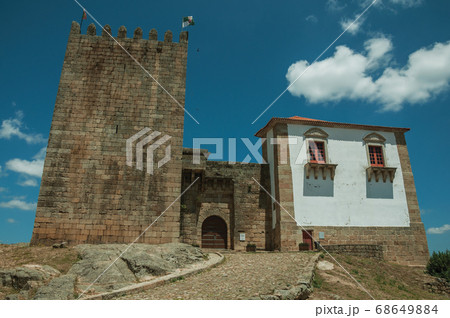 Stone tower over rocky hill at the medieval Belmonte Castle 68649884