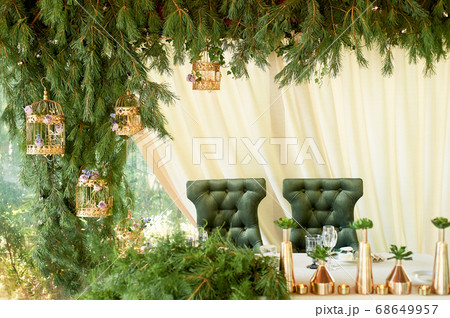Velvet green chair with a carriage screed.Palace interior. 68649957