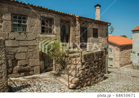Old houses and stone staircase on cobblestone alley Old houses and stone staircase on cobblestone alley 68650671