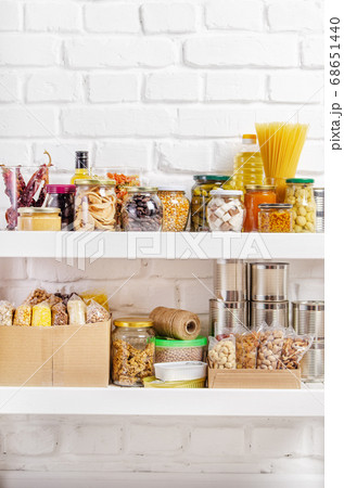 Set of long storage term foods on pantry shelf 68651440