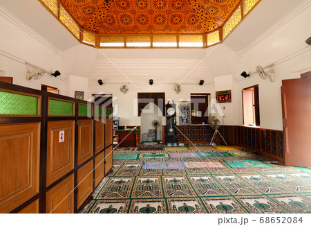 PATTANI, THAILAND -JULY 10, 2014: Historic Kru Se mosque which is made of bricks with round pillars. The mosque represents a unique Islamic civilization of the Kingdom of Pattani in Thailand. PATTANI, THAILAND -JULY 10, 2014: Historic Kru Se mosque which is made of bricks with round pillars. The mosque represents a unique Islamic civilization of the Kingdom of Pattani in Thailand. 68652084