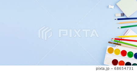 School supplies on a blue background. 68654731
