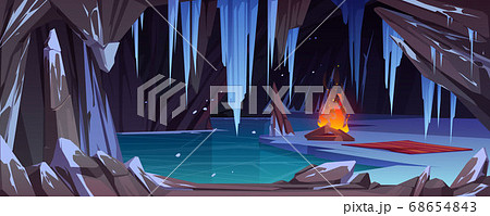 Dark ice cave in mountain with bonfire 68654843