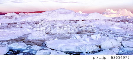 Iceberg and ice from glacier in arctic nature landscape on Greenland 68654975