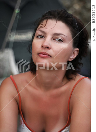 Portrait of beautiful young woman with brown hair 68655512