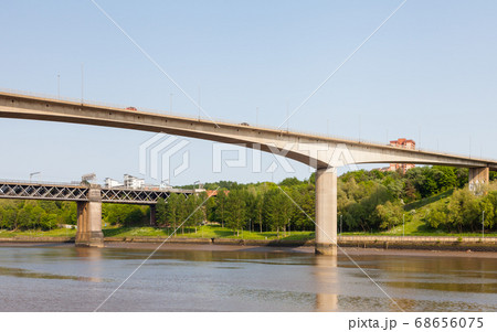 Traffic is seen crossing Redheugh Bridge over the River Tyne and in the background is the King Edward VII railway bridge. The bridges connect Newcastle upon Tyne and Gateshead. Traffic is seen crossing Redheugh Bridge over the River Tyne and in the background is the King Edward VII railway bridge. The bridges connect Newcastle upon Tyne and Gateshead. 68656075