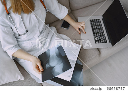 Woman doctor with white coat in hospital Woman doctor with white coat in hospital 68658757