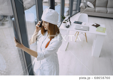 Woman doctor with white coat in hospital 68658760