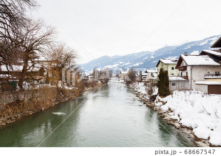 The Salzach River flows through the village of Bruck an der Grossglocknerstrasse in the state of Salzburg, Austria.	 68667547