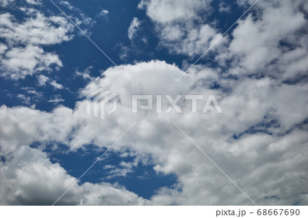 Field of cumulus clouds in blue sky 68667690