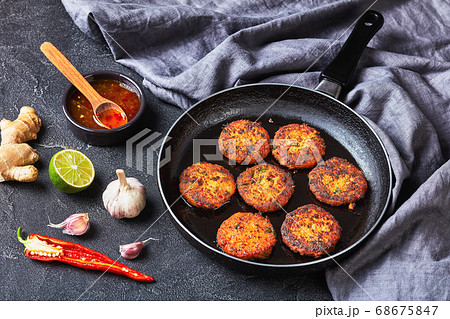 fried thai fish cakes on a skillet 68675847