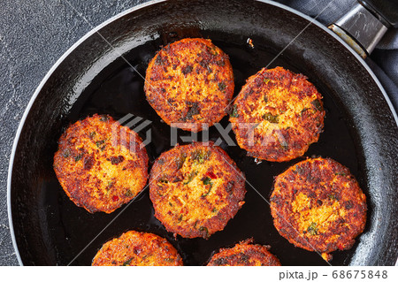 fried thai fish cakes on a skillet fried thai fish cakes on a skillet 68675848