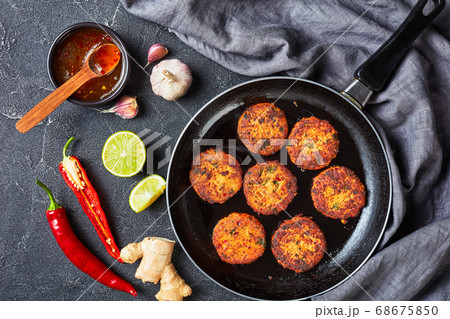 fried thai fish cakes on a skillet 68675850