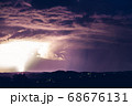 Night landscape on a background of thunderstorms. 68676131