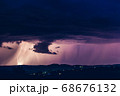 Night landscape on a background of thunderstorms. 68676132