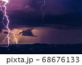 Night landscape on a background of thunderstorms. 68676133