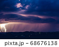 Night landscape on a background of thunderstorms. 68676138