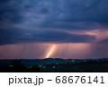 Night landscape on a background of thunderstorms. 68676141