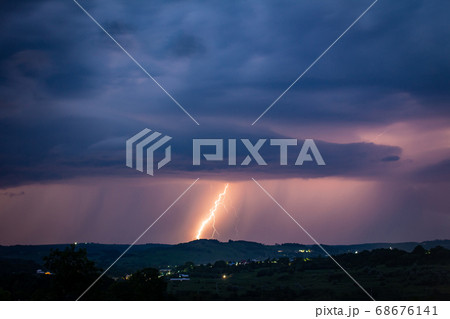 Night landscape on a background of thunderstorms. Night landscape on a background of thunderstorms. 68676141