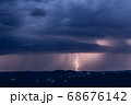 Night landscape on a background of thunderstorms. 68676142