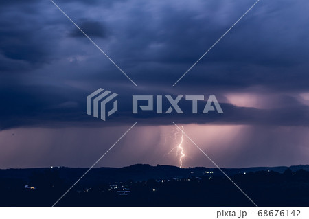 Night landscape on a background of thunderstorms. 68676142