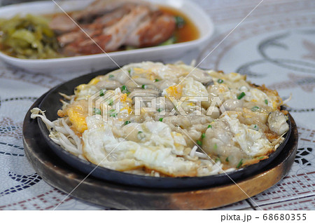 Oyster omelette or stir fried Oyster with egg and Oyster omelette or stir fried Oyster with egg and 68680355