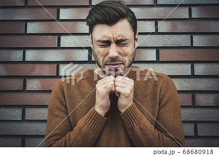 Religion concept. Caucasian young man praying Religion concept. Caucasian young man praying 68680918