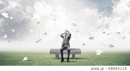 Young man in suit in park dont want to hear anything Young man in suit in park dont want to hear anything 68683128